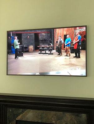 Tv against green wall image